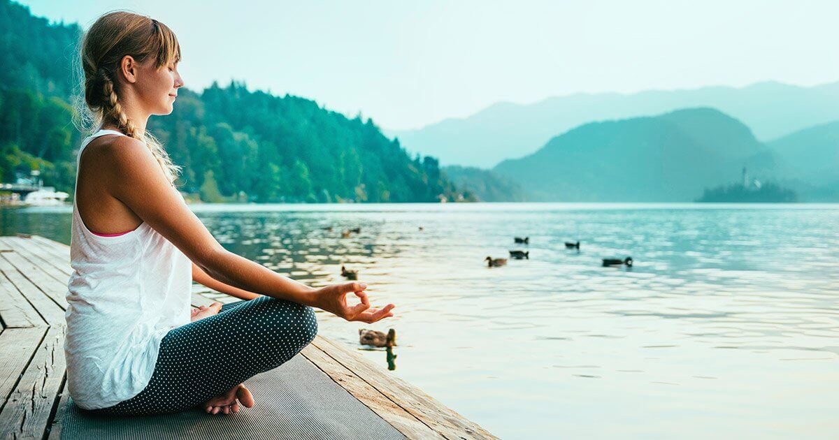 Zeolite_blog_fb woman meditating by water